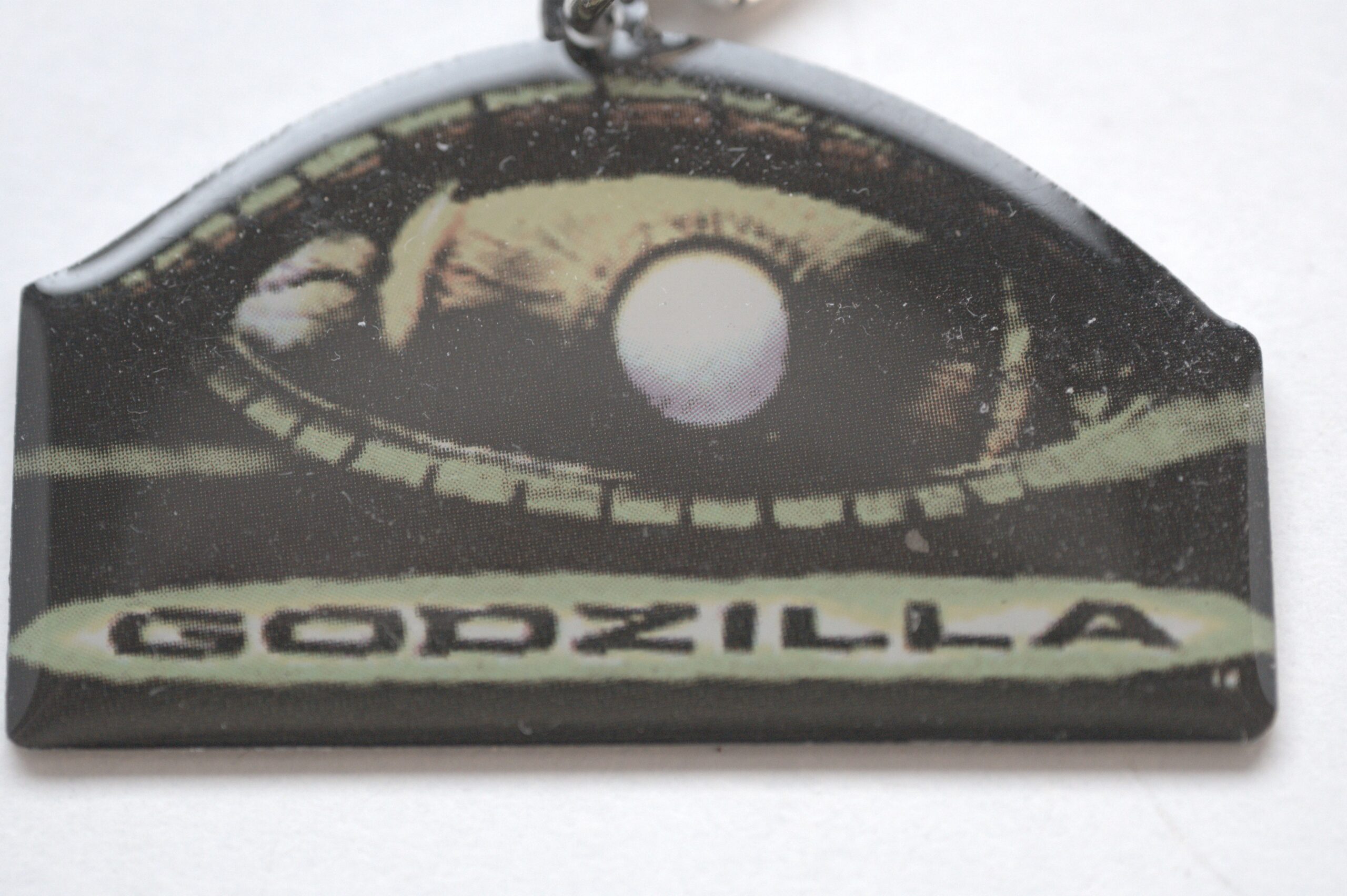 Godzilla Schlüsselanhänger – ikonisches Augen-Motiv – Fanartikel