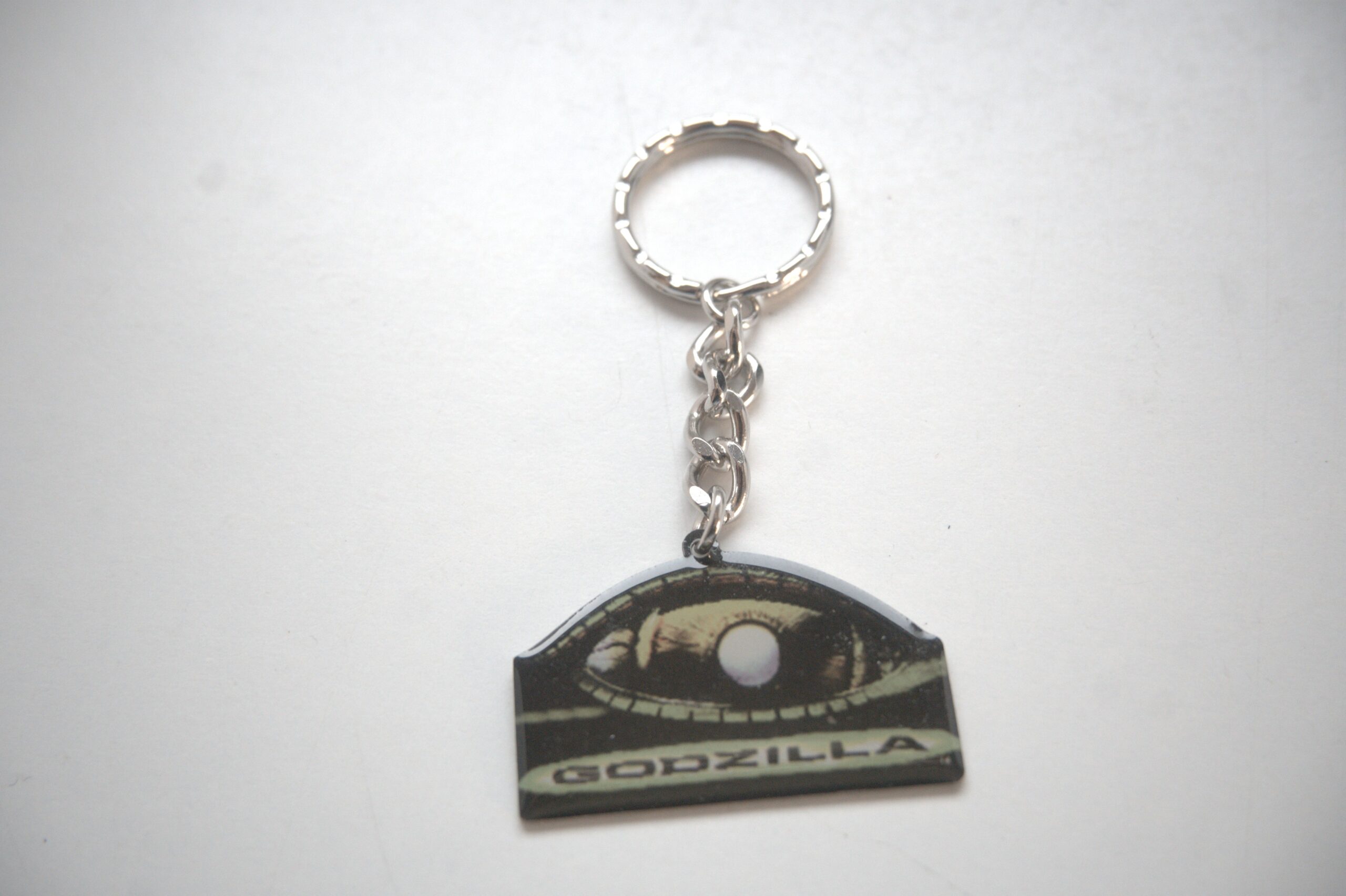 Godzilla Schlüsselanhänger – ikonisches Augen-Motiv – Fanartikel – Bild 2